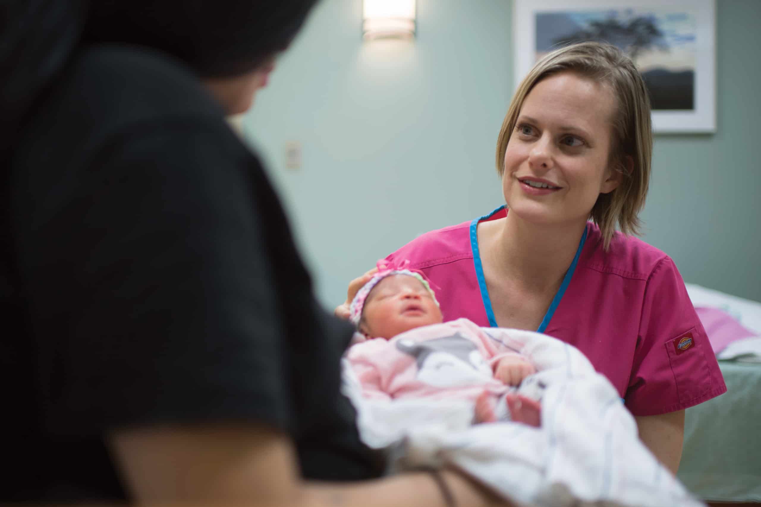 birth center nurse with mom and baby